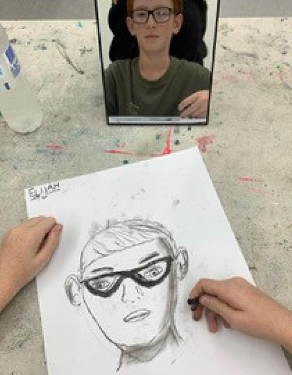 Drawing of a face with glasses