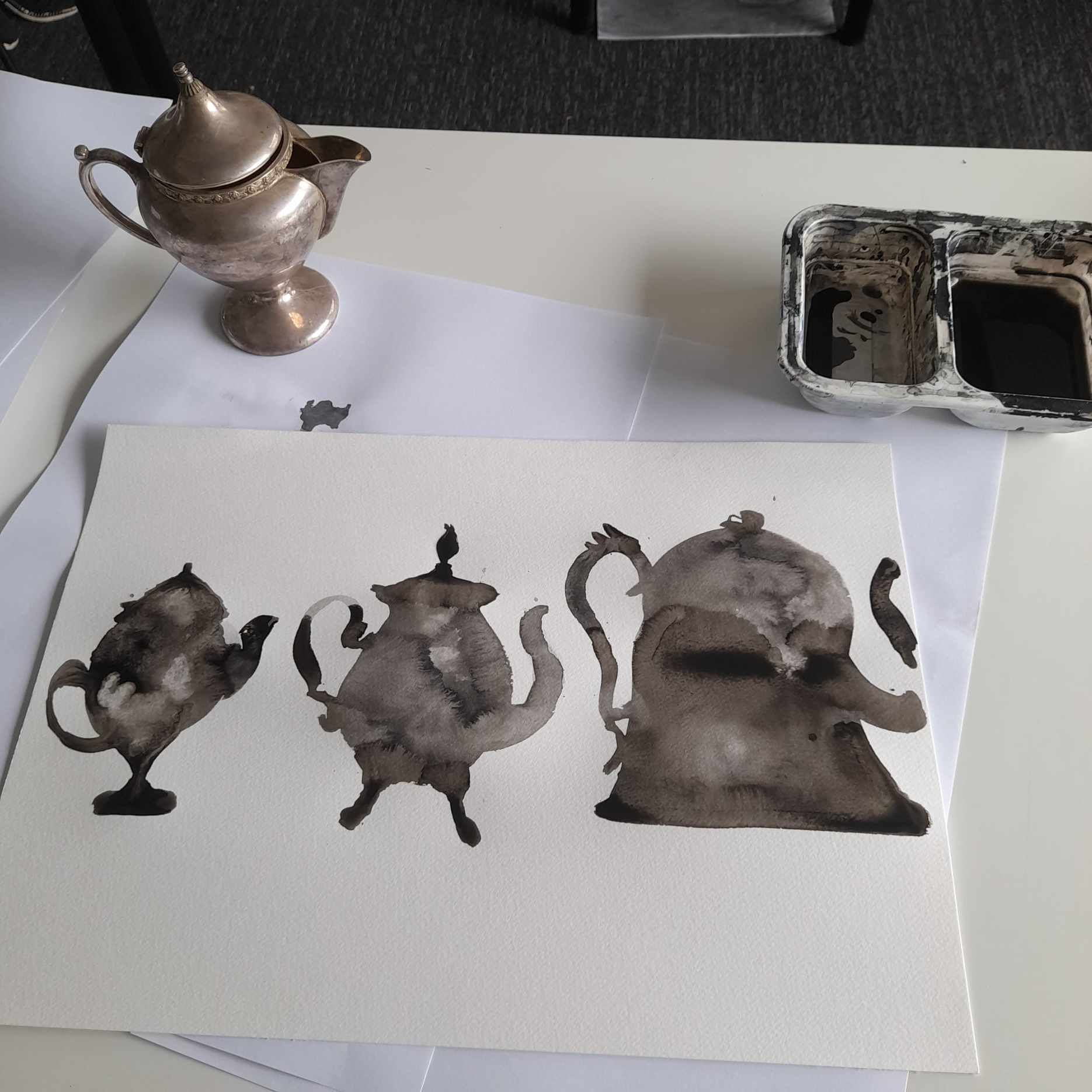 Painting of teapots with black Ink