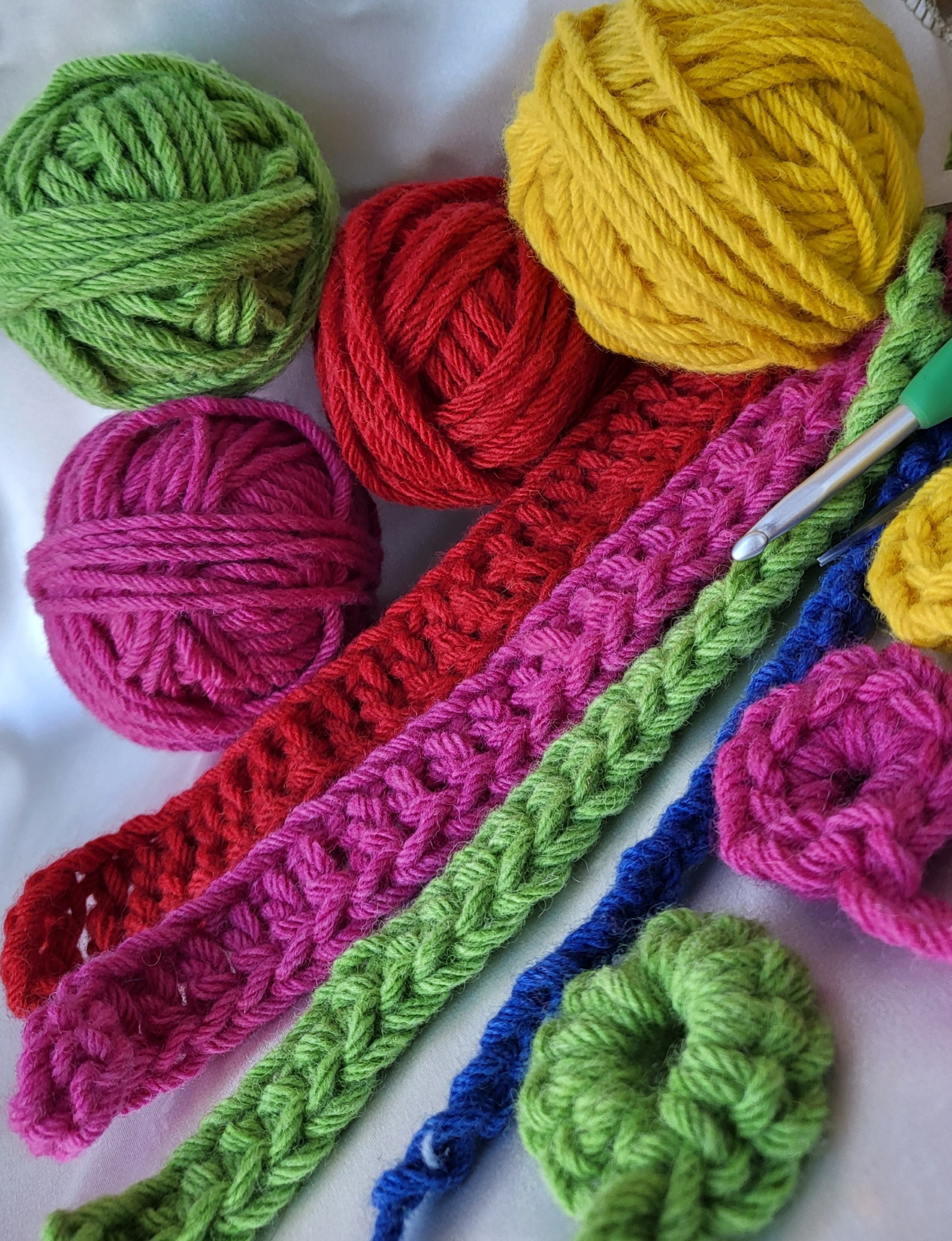 Balls of coloured wool with crochet 