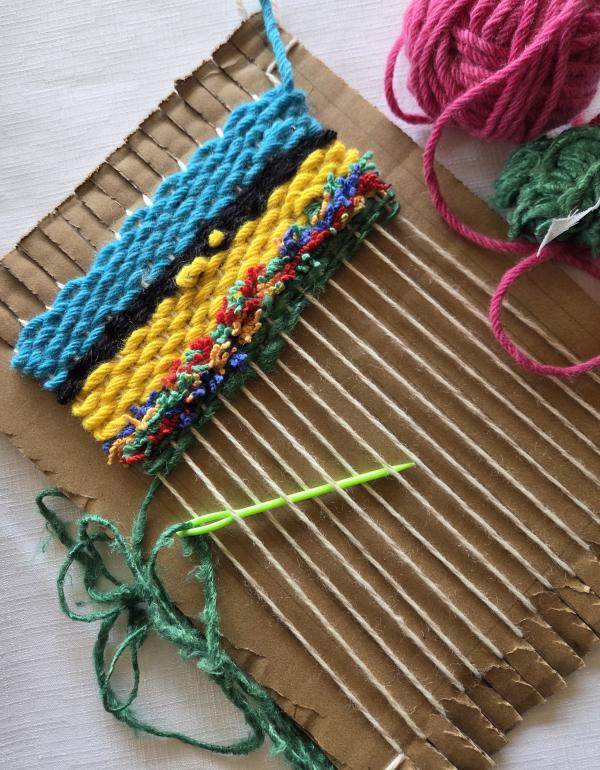 cardboard loom with wool weaving