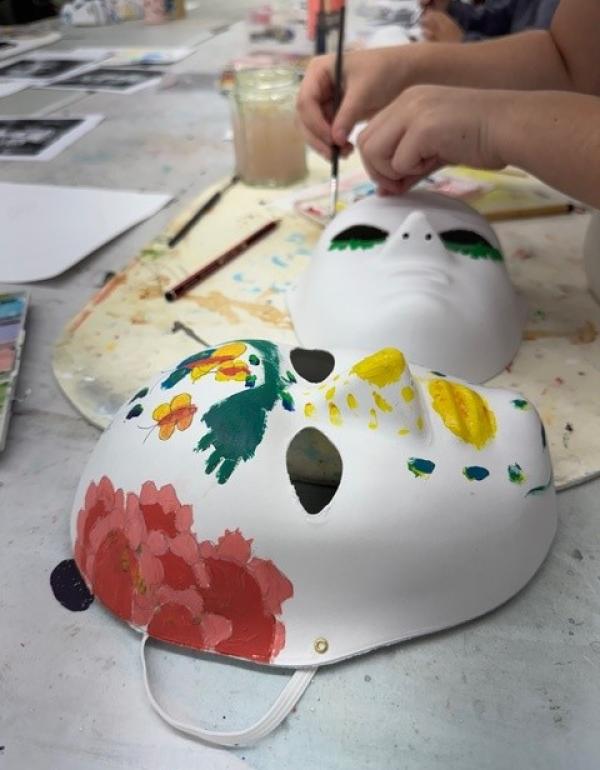Hand painting on a white paper machai mask
