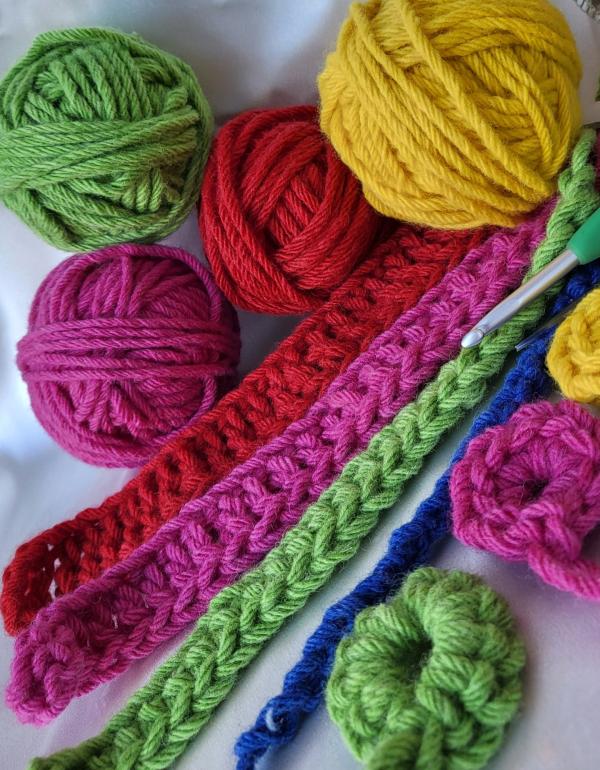 Balls of coloured wool with crochet 