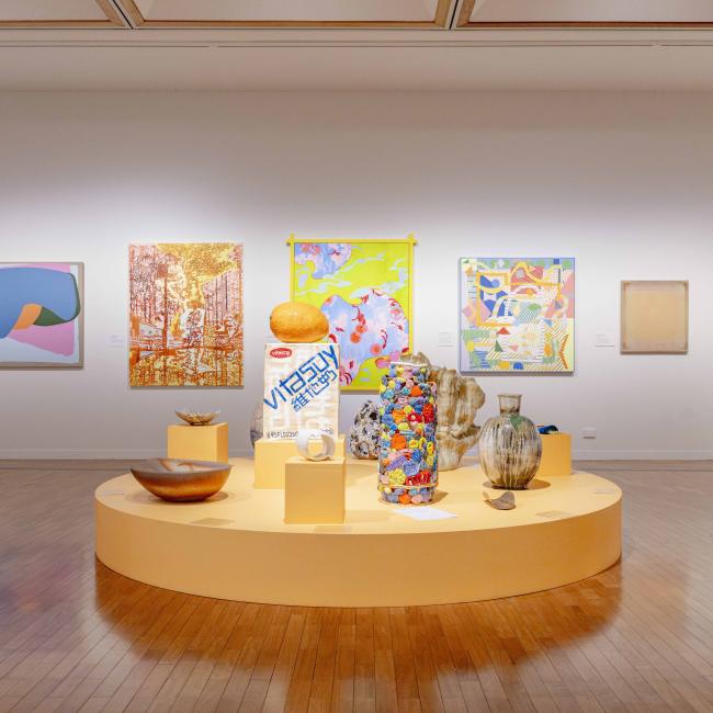 Orange plinth with colourful ceramic pieces